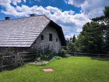 House on field against sky