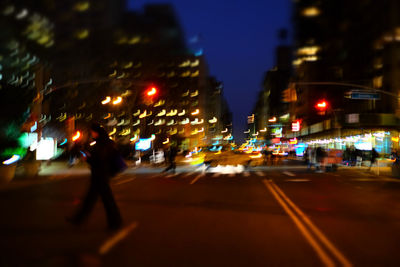 People walking on road in city at night