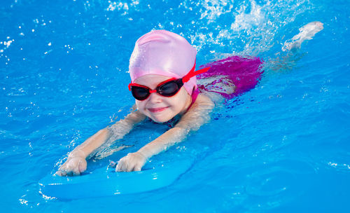 Young woman swimming in sea