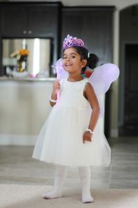 Portrait of smiling girl standing at home