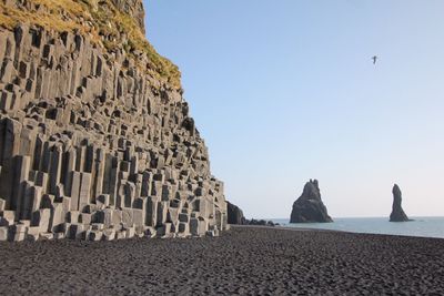 Panoramic view of beach against clear sky