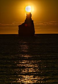 Scenic view of sea at sunset