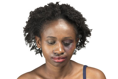 Close-up portrait of a young woman over white background