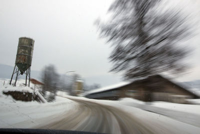 Close-up of car on road in winter