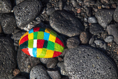 High angle view of multi colored stones on stone wall