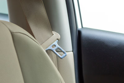 Close-up of seat belt in car