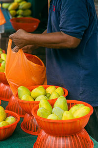 Selling fresh mangoes at the stall.