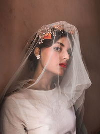 Portrait of young woman with umbrella