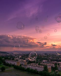 Aerial view of hot air balloon against sky during sunset