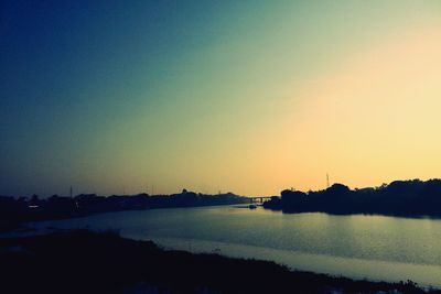 Scenic view of calm sea at sunset