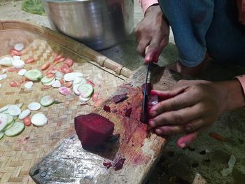 Midsection of man working on table