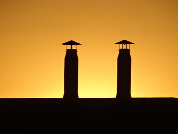 Silhouette bird against sky during sunset