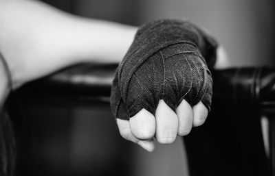 Cropped image of man wearing boxing glove