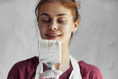 Close-up of young woman holding ice cream