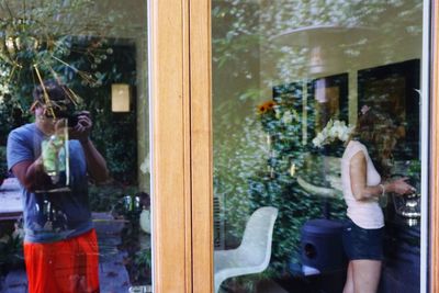 Reflection of woman on glass window