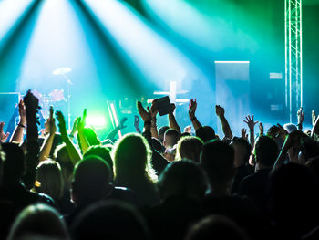 Rear view of crowd enjoying during music concert