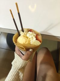 Midsection of person holding ice cream