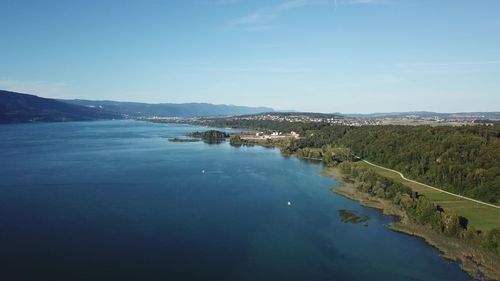 Scenic view of lake against blue sky
