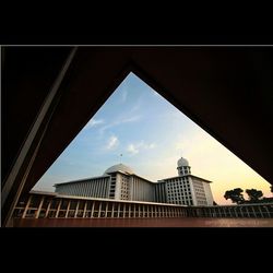 Low angle view of office building against sky