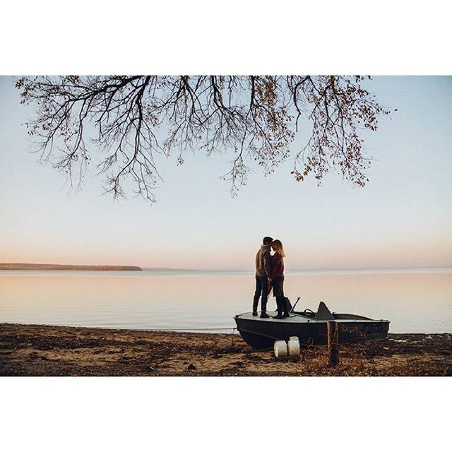 water, sitting, horizon over water, sea, clear sky, tranquil scene, lifestyles, tranquility, leisure activity, rear view, full length, scenics, relaxation, men, beauty in nature, nature, sky, tree