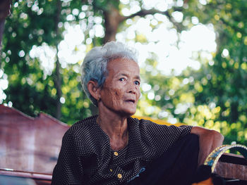 Portrait of young woman looking away