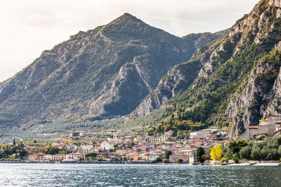 Scenic view of sea and buildings against sky