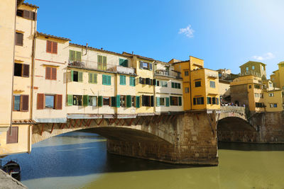 Ponte vecchio bridge over arno river in florence, italy.