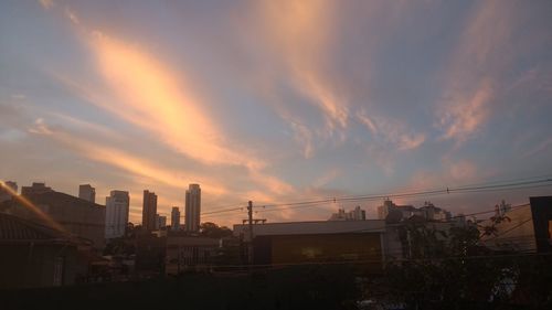 Cityscape against sky during sunset