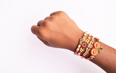 Close-up of hands against white background