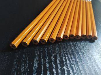 High angle view of piano keys on wood