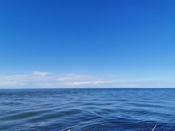 Scenic view of sea against blue sky