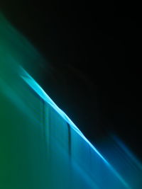 Low angle view of illuminated lights on wall at night