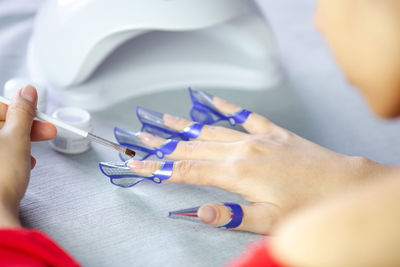 Close-up of woman holding hands