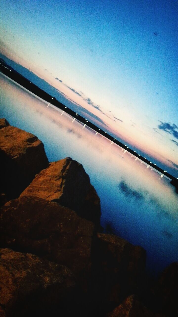 water, sea, sky, scenics, horizon over water, rock - object, tranquil scene, nature, tranquility, beauty in nature, blue, reflection, idyllic, rock formation, rock, cloud - sky, outdoors, no people, day, transportation