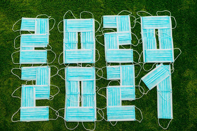 High angle view of text on grassy field