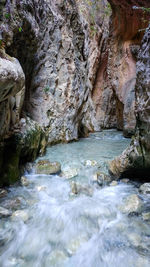 View of waterfall along rocks