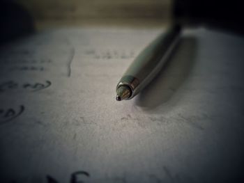 Close-up of pen on paper