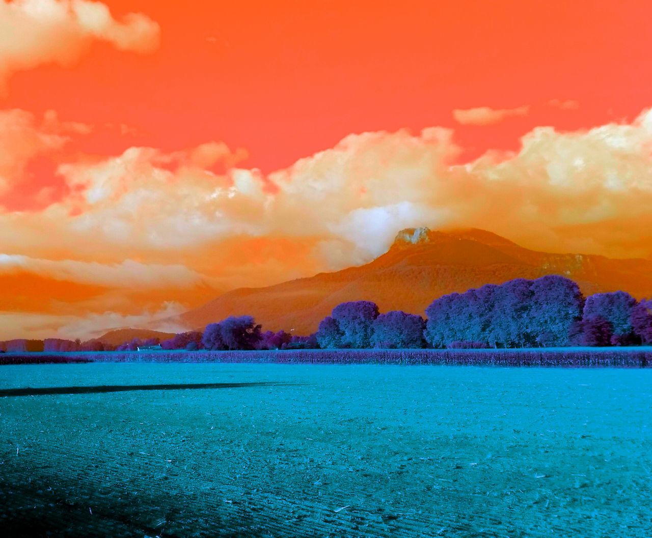 SCENIC VIEW OF DRAMATIC SKY OVER SEA AND MOUNTAIN