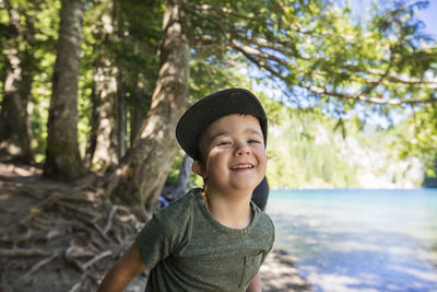 Portrait of smiling boy in forest