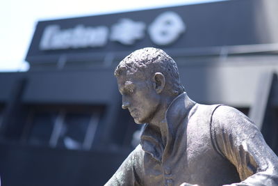 Close-up of statue against building