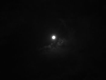 Low angle view of moon against sky at night