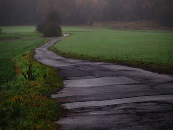 Road passing through field