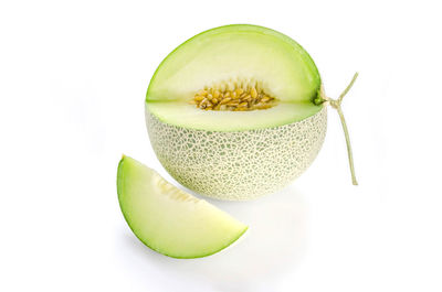 Close-up of fruit against white background