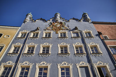 Low angle view of building against blue sky