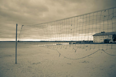 Scenic view of beach against sky during winter