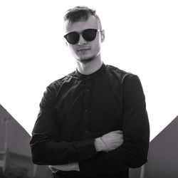 Portrait of young man wearing sunglasses standing outdoors