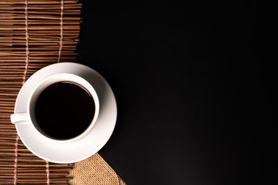 Directly above shot of coffee cup on table