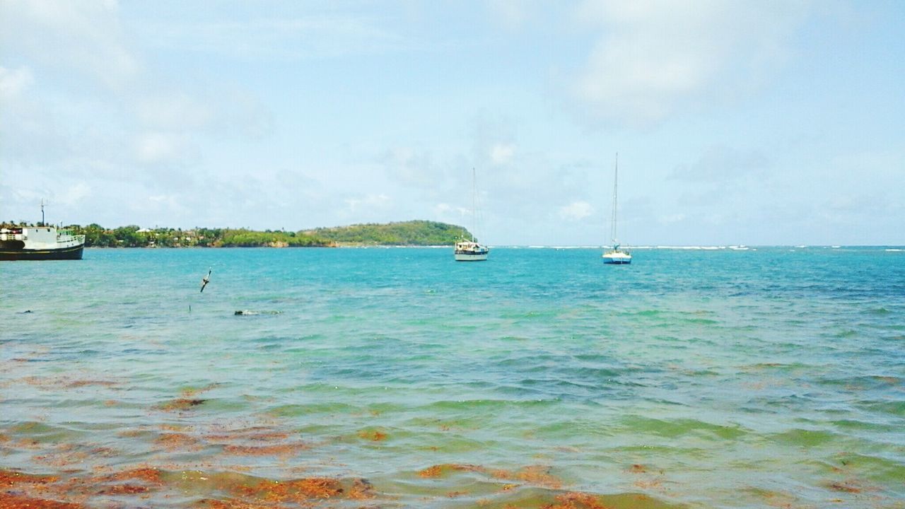 nautical vessel, transportation, mode of transport, boat, water, sea, sky, moored, tranquil scene, tranquility, scenics, sailboat, beauty in nature, horizon over water, nature, blue, sailing, travel, mast, cloud - sky