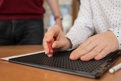 Midsection of man using laptop