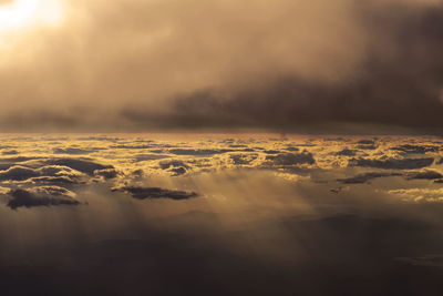 Aerial view of sea against sky during sunset